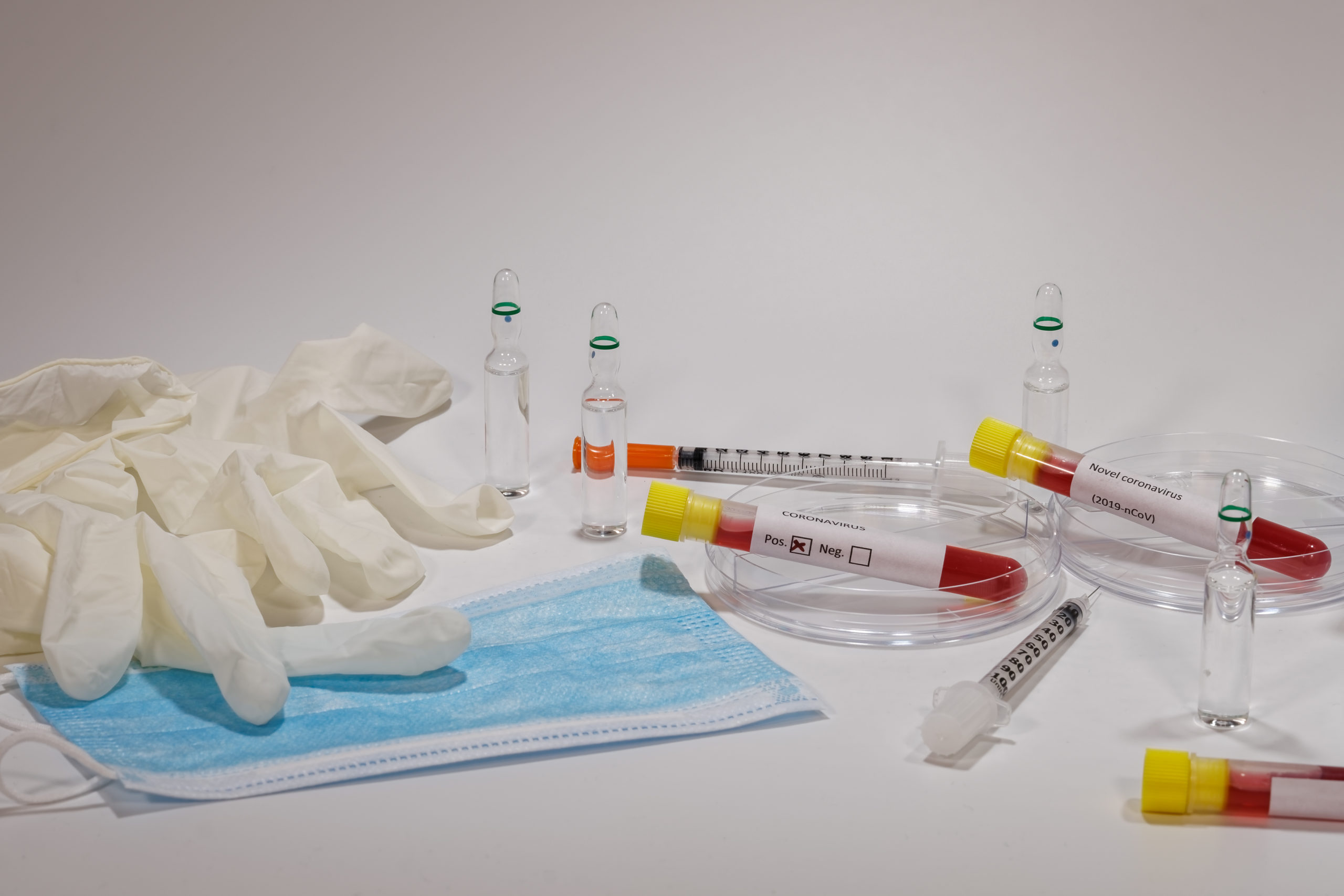 Coronavirus 2019-nCoV world outbreak tests on microbiology lab. Wuhan virus Clinical tests with laboratory testing medical equipment like vacutainer blood tubes, syringes, protective mask & gloves.